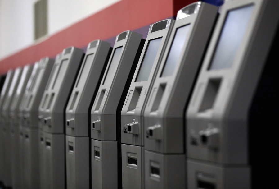 In this Wednesday, Aug. 30, 2017, photo, automated teller machines are lined up during the manufacturing process at Diebold Nixdorf in Greensboro, N.C. With the exception of the vending machine, no piece of technology has done more to create the culture of “self-service” than the ATM. 2017 marks the 50th anniversary of the ATM.