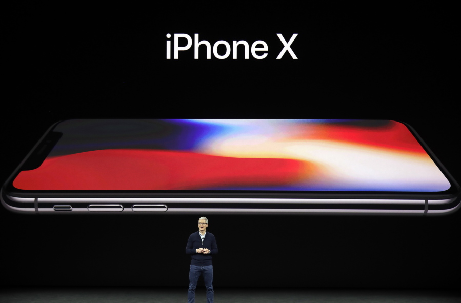 Apple CEO Tim Cook announces the new iPhone X at the Steve Jobs Theater on the new Apple campus, Tuesday in Cupertino, Calif.
