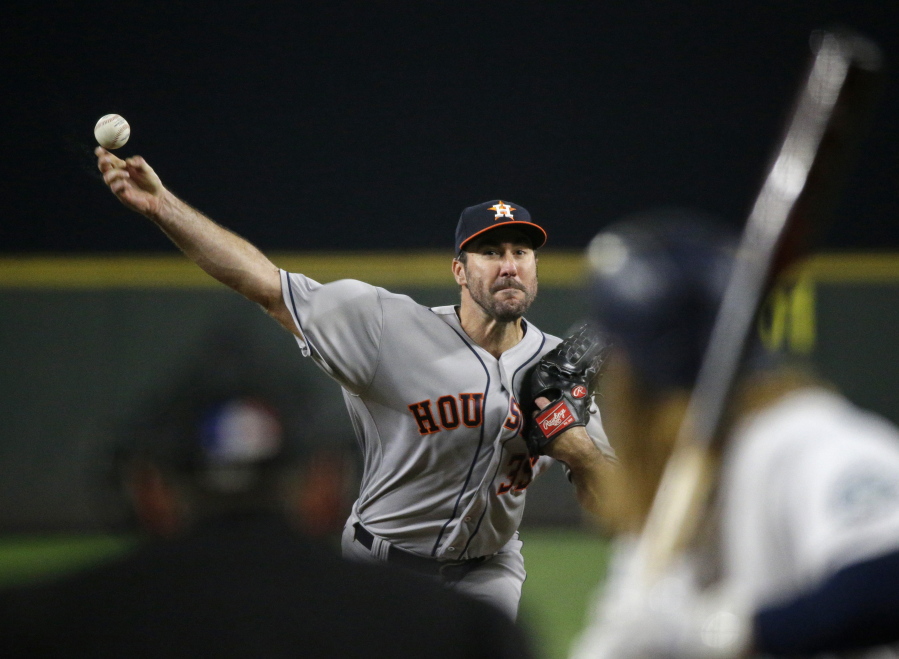 Houston Astros starting pitcher Justin Verlander throws to a Seattle Mariners batter during the fifth inning of a baseball game, Tuesday, Sept. 5, 2017, in Seattle. (AP Photo/Ted S.