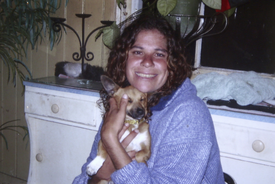 Lynette Daley holds her dog in Australia. More than six years after Daley, an Aboriginal woman, bled to death from a violent sexual assault on a remote beach, a jury convicted two men on Wednesday, Sept. 6, 2017 in connection with her death in a case that horrified Australians and exposed the nation’s deep racial divide.