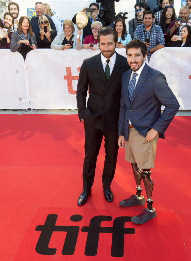 Jake Gyllenhaal, left, and Boston Marathon bombing victim Jeff Bauman appear Sept. 8 at the premiere of the film “Stronger” during the 2017 Toronto International Film Festival in Toronto. Gyllenhaal portrays Bauman in the film.