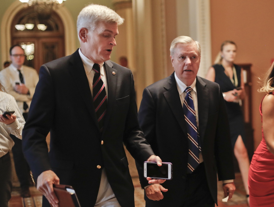 Sen. Bill Cassidy, R-La., left, and Sen. Lindsey Graham, R-S.C., right, talk while walking to a meeting on Capitol Hill in Washington. Senate Republicans are planning a final, uphill push to erase President Barack Obama’s health care law. But Democrats and their allies are going all-out to stop the drive. The initial Republican effort crashed in July in the GOP-run Senate. Majority Leader Mitch McConnell said after that defeat that he’d not revisit the issue without the votes to succeed. Graham and Cassidy are leading the new GOP charge and they’d transform much of Obama’s law into block grants and let states decide how to spend the money.