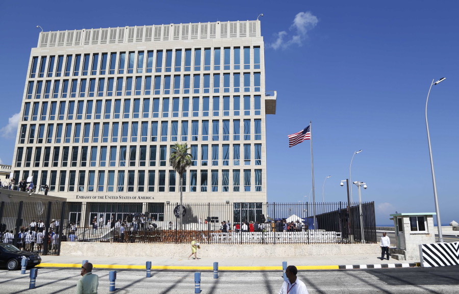 A U.S. flag flies Aug. 14, 2015 at the U.S. embassy in Havana, Cuba. U.S. investigators are chasing many theories about what’s harming American diplomats in Cuba, including a sonic attack, electromagnetic weapon or flawed spying device.