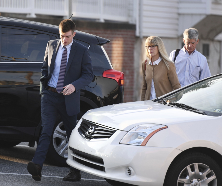 Beta Theta Pi President Brendan Young arrives for the seventh day of preliminary hearings Thursday at the Centre County Courthouse in Bellefonte, Pa. A judge on Friday threw out involuntary manslaughter and felony assault counts filed against members of a Penn State fraternity in a pledge’s alcohol hazing-related death, ordering 12 of the frat brothers to stand trial on lesser counts.