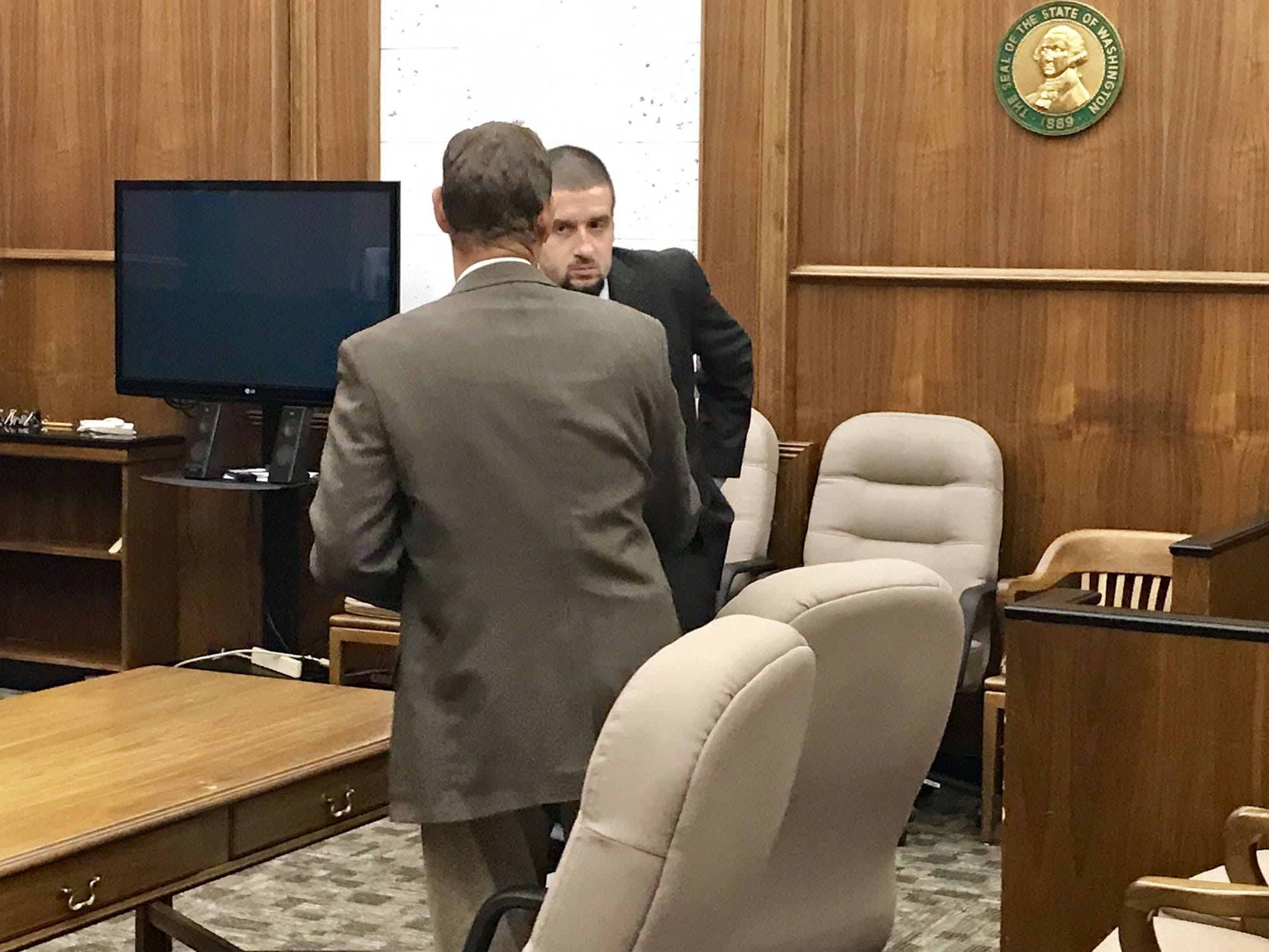 Vancouver's Brandon Gorham briefly talks with his attorney Friday, Sept. 8, 2017, after hearing the verdict in his attempted murder trial in Clark County Superior Court. The jury acquitted Gorham of attempted murder but convicted him of first-degree assault and hit-and-run resulting in injury.