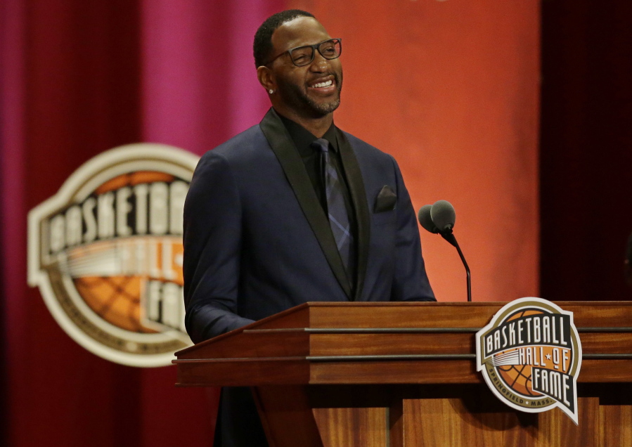 Tracy McGrady speaks during his enshrinement into the Naismith Memorial Basketball Hall of Fame, Friday, Sept. 8, 2017, in Springfield, Mass. McGrady is a seven-time NBA All-Star and a two-time NBA scoring champion who played for seven NBA teams in his 16-season pro career.