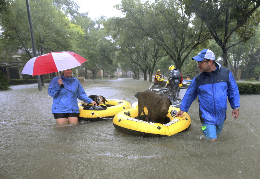 Residents and pets are evacuated from their homes as floodwaters from Tropical Storm Harvey rise in Houston. Animal Planet is airing a special Saturday night called “Surviving Harvey: Animals After the Storm.” The program airs Saturday at 8 p.m. on the East and West coasts. (Godofredo A.