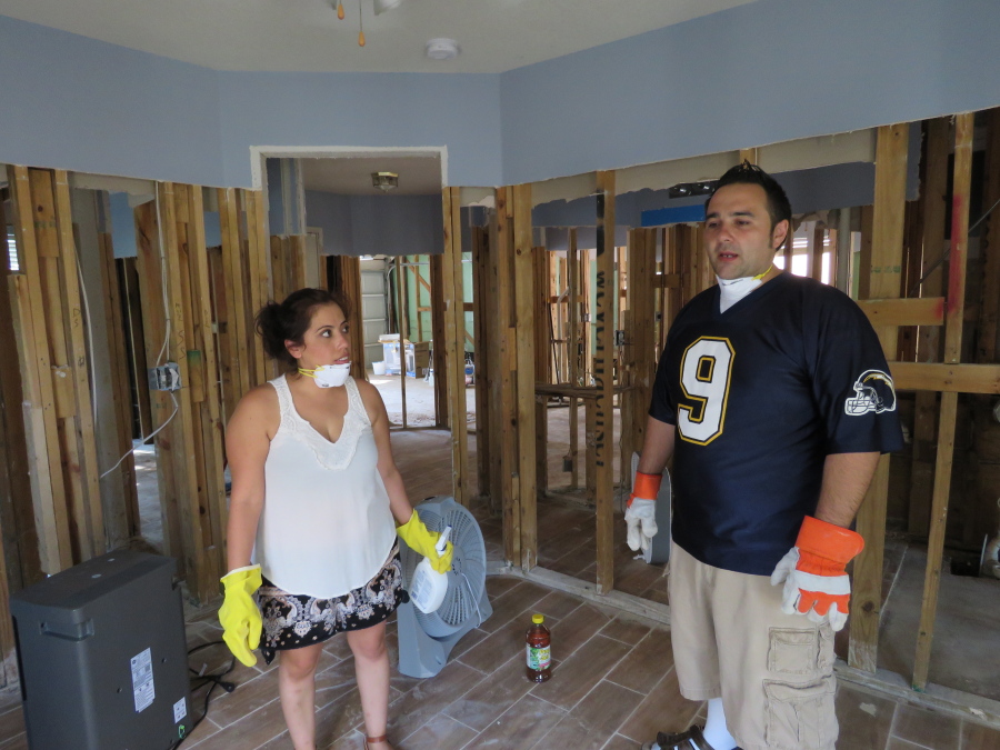 Marcela and Eli Magana discuss cleaning up their suburban Houston home on Sept. 22, which was flooded during Harvey’s torrential rainfall. The couple’s home in Fort Bend County was flooded when the levels of a nearby reservoir swelled beyond capacity during Harvey and spilled over into neighboring subdivisions. The Maganas and other flooded homeowners in subdivisions near the reservoir are questioning whether officials in Fort Bend County did enough to warn them the reservoir could overflow during a heavy storm event and inundate their homes.