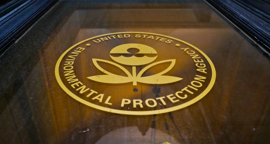 In this Sept. 21, 2017, photo, a sign on a door of the Environmental Protection Agency in Washington. The EPA says it has recovered 517 containers of “unidentified, potentially hazardous material” from highly contaminated toxic waste sites in Texas that flooded last month during Hurricane Harvey. But the agency has not provided details about which Superfund sites the material came from, why the contaminants at issue have not been identified and whether there’s a threat to human health.