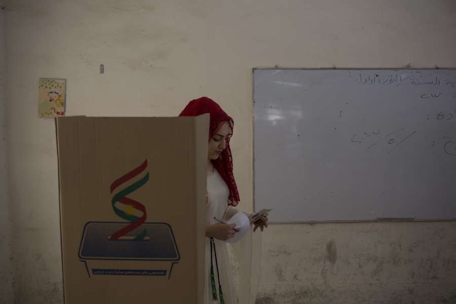 A Kurdish woman leaves the voting booth after voting for Kurdish independence in the city of Kirkuk, Monday Sept. 25, 2017. Iraq’s Kurdish region vote in a referendum on whether to secede from Iraq.