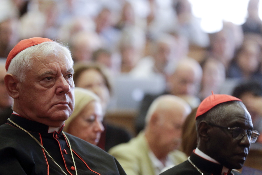 Cardinals Gerhard Ludwig Mueller, left, and Robert Sarah attend a conference on the Latin Mass at the Pontifical University of St. Thomas Aquinas in Rome.