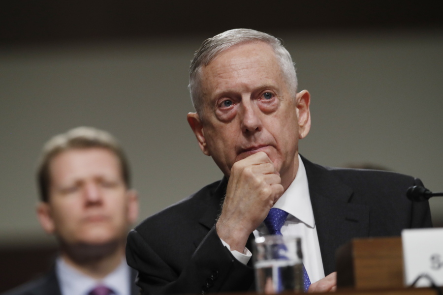 FILE - In this June 13, 2017, file photo, Defense Secretary Jim Mattis listens on Capitol Hill in Washington, while testifying before the Senate Armed Services Committee hearing on the Pentagon's budget. As North Korea flaunts its new nuclear muscle, Defense Secretary Jim Mattis is spotlighting the overwhelming numerical superiority of America’s doomsday arsenal. On Wednesday, Sept. 13, he is dropping in on ground zero of American nuclear firepower: Minot Air Force base in North Dakota, home to more than 100 land-based nuclear missiles as well as nuclear bomb-toting aircraft.