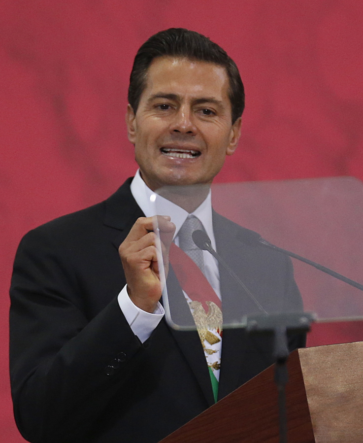 Mexico’s President Enrique Pena Nieto delivers his annual state-of-the-union address Saturday at the National Palace in Mexico City.