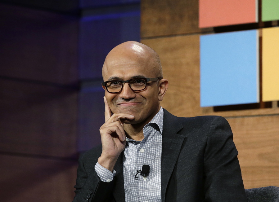 FILE - In this Wednesday, Nov. 30, 2016, file photo, Microsoft CEO Satya Nadella listens to a question at the annual Microsoft shareholders meeting in Bellevue, Wash. Nadella has written an autobiography recounting his efforts to transform the technology company with a focus on empathy and changing its workplace culture. The book, “Hit Refresh,” also reveals some personal challenges, such as his risky move to switch his green card to a temporary work visa in the 1990s so that his wife could join him in the United States.