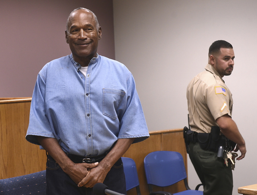 FILE - In this July 20, 2017, file photo, former NFL football star O.J. Simpson enters for his parole hearing at the Lovelock Correctional Center in Lovelock, Nev. A Nevada prisons official says a plan is in place for Simpson to be released to parole as early as Monday, Oct. 2, 2017, from a facility in the Las Vegas area. Nevada Department of Corrections spokeswoman Brooke Keast said Wednesday, Sept. 27 that the process and documents still must be finalized for Simpson’s release after nine years behind bars for an armed robbery conviction.