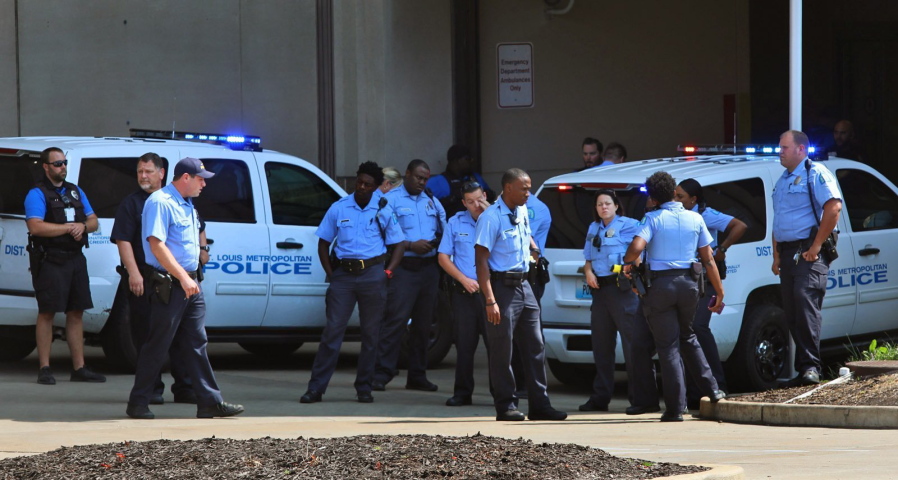 St. Louis Police gather at Barnes-Jewish Hospital after two officers were shot in North St. Louis, on Friday, Sept. 1, 2017. (Christian Gooden/St.