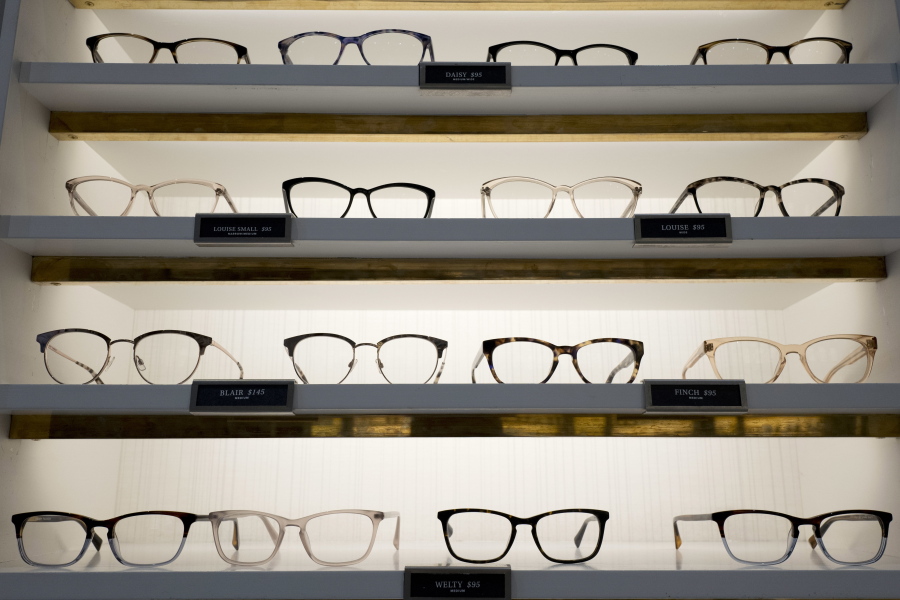 Warby Parker eyewear is displayed at a company retail store Wednesday in New York. At Warby Parker, you can pick out five frames to try for five days for free.