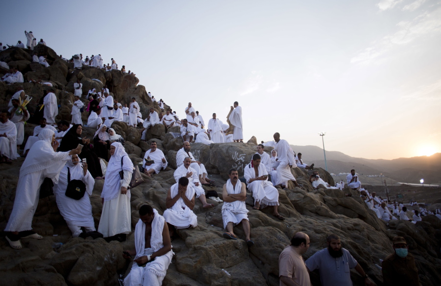 Muslim pilgrims gather Thursday to pray on and around the Jabal Al Rahma holy mountain, or the mountain of forgiveness, at Arafat for the annual hajj pilgrimage outside the holy city of Mecca, Saudi Arabia.