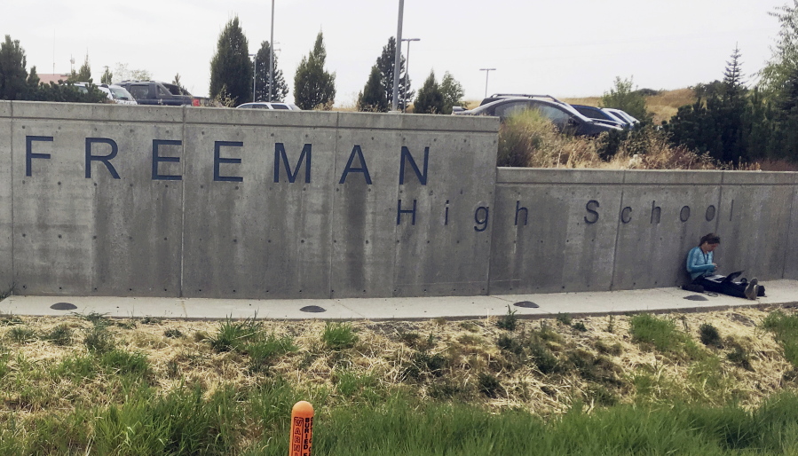 The sign for Freeman High School in Rockford is seen outside the campus Wednesday. Authorities say one student was killed and three others were injured in a shooting at the school. A suspect was taken into custody. (AP Photo/Nicholas K. Geranios).