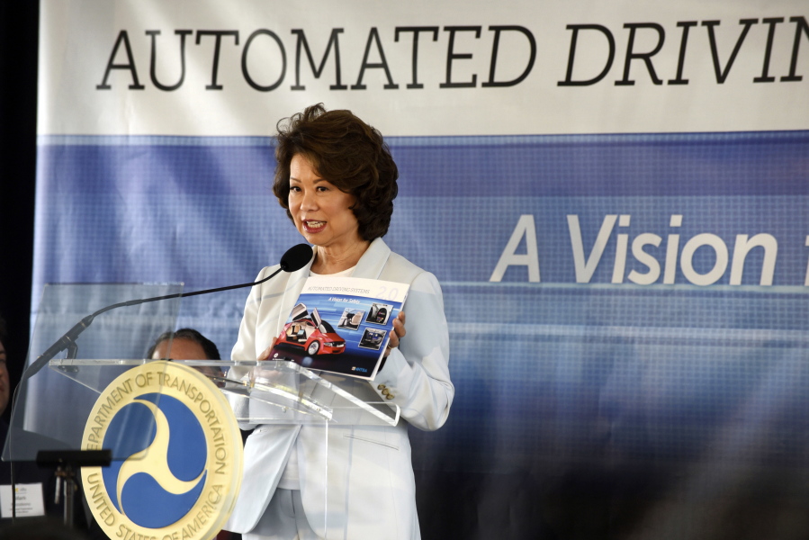U.S. Transportation Secretary Elaine Chao announces new voluntary safety guidelines for self-driving cars during a visit to an autonomous vehicle testing facility, Tuesday, Sept. 12, 2017, at the University of Michigan, in Ann Arbor, Mich. The new guidelines update policies issued last fall by the Obama administration, which were also largely voluntary.