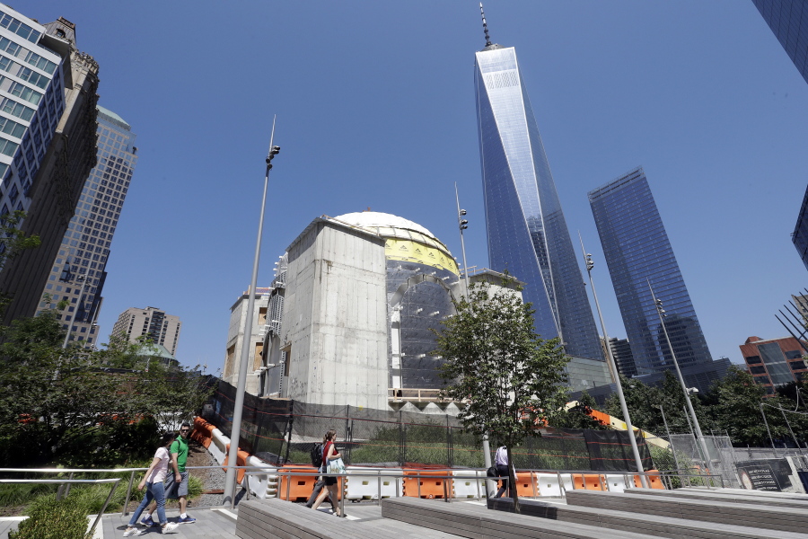 In this Aug. 10, 2017 photo, the St. Nicholas National Shrine, center, designed by renowned architect Santiago Calatrava, is under construction at the World Trade Center in New York. It is replacing a tiny Greek Orthodox church that was crushed by the Trade Center’s south tower during the terrorist attacks of Sept. 11, 2001.