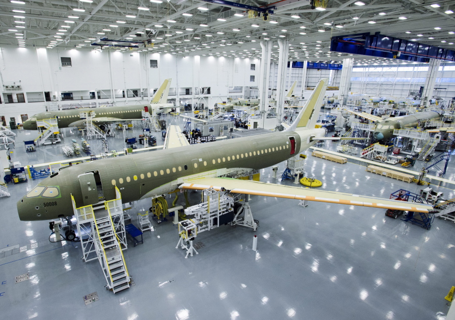 FILE- In this Dec. 18, 2015, file photo, Bombardier’s CS100 assembly line is seen at the company’s plant in Mirabel, Quebec, Canada. The U.S Commerce Department slapped duties of nearly 220 percent on Canada’s Bombardier C Series aircraft Tuesday, Sept. 26, 2017, in a victory for Boeing that is likely to raise tensions between the United States and its allies Canada and Britain.