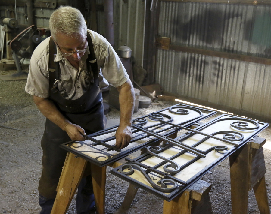 Scott Wadsworth works on a project July 21 in his Roseburg, Ore., shop. Wadsworth has been fascinated by blacksmiths since he was 12 years old.
