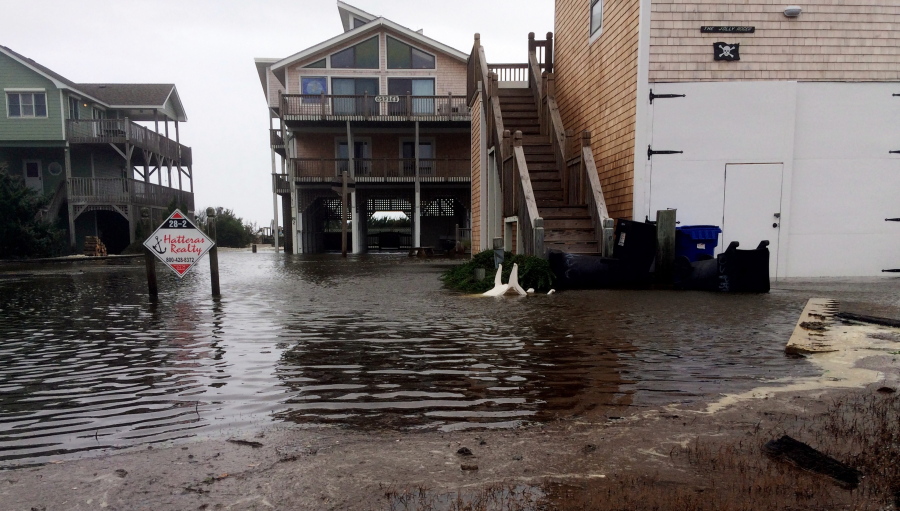 Floodwaters surround homes as Hurricane Maria moves closer to North Carolina’s Outer Banks on Tuesday. Thousands of visitors abandoned their vacation plans and left the area as the hurricane moved northward in the Atlantic, churning up surf and possible flooding.
