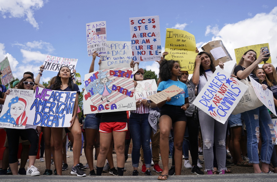 Supporters of Deferred Action for Childhood Arrival program demonstrate Saturday on Pennsylvania Avenue in front of the White House in Washington.