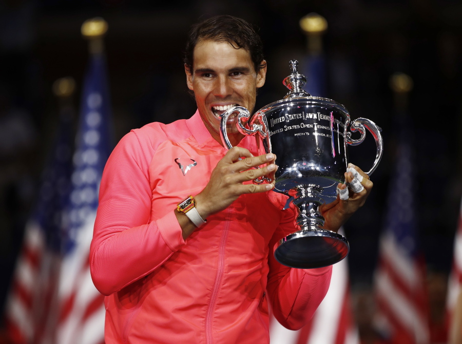 Rafael Nadal, of Spain, holds up the championship trophy after beating Kevin Anderson, of South Africa, in the men’s singles final of the U.S. Open tennis tournament, Sunday, Sept. 10, 2017, in New York.