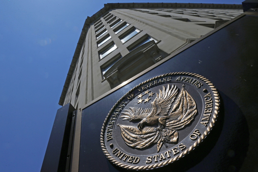 In this June 21, 2013, file photo, the seal affixed to the front of the Department of Veterans Affairs building in Washington. A new first-of-its kind government study finds suicide among military veterans is especially high in the western U.S. and rural areas. The numbers suggest that social isolation, gun ownership and limited health care access may be factors behind the higher numbers. The Department of Veterans Affairs released data Sept. 15, on suicide by state.