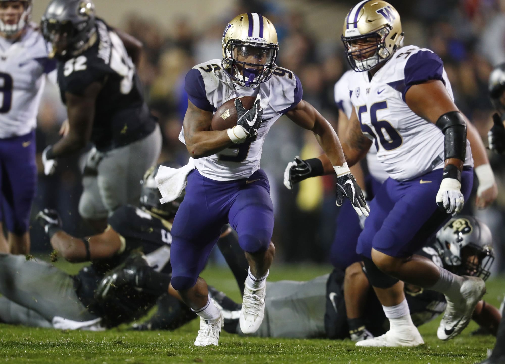 Washington running back Myles Gaskin carries for a long gain against Colorado during the second half of an NCAA college football game Saturday, Sept. 23, 2017, in Boulder, Colo. Washington won 37-10.