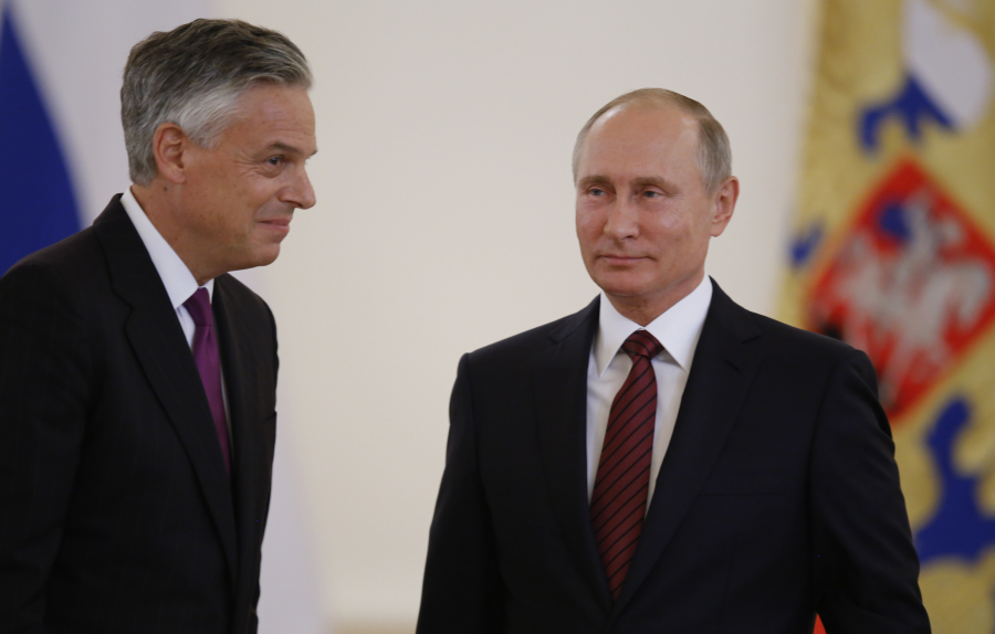 U.S. Ambassador Jon Huntsman, left, walks with Russian President Vladimir Putin after presenting his credentials Tuesday at a ceremony in Moscow.
