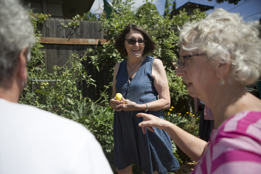 Susan Sanders retired back to Vancouver, where she grew up, in 2008. She appreciates Vancouver’s location because she likes to travel, she said, but she also loves downtown’s historic feel. And, she participates in Clark County’s annual self-guided tour of organic gardens; here, she welcomes visitors to her garden in summer 2017.