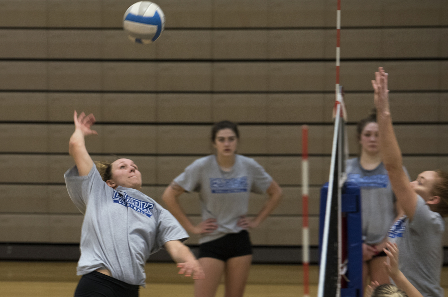 Clark College’s Dalaney Tuholski jumps for a spike during practice. The Heritage High grad is back playing volleyball after taking a year off.