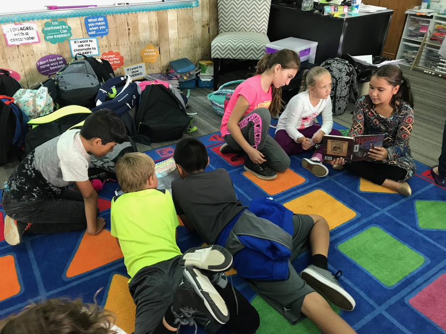 Fourth-graders read to second-grade students at Woodland Intermediate School as part of the Buddy Reading program.
