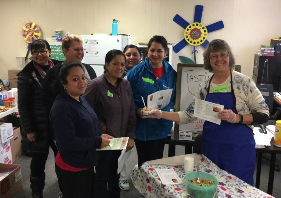 María Mis, from left, Teresa Solórzano, Raquel Vázquez, María Martínez, Carina Smith, Luisa Turner and Marty Fields attend a food tasting hosted by the Washington State University Extension’s Supplemental Nutrition Assistance Program Education in Marrion Elementary School’s Family Community Resource Center.