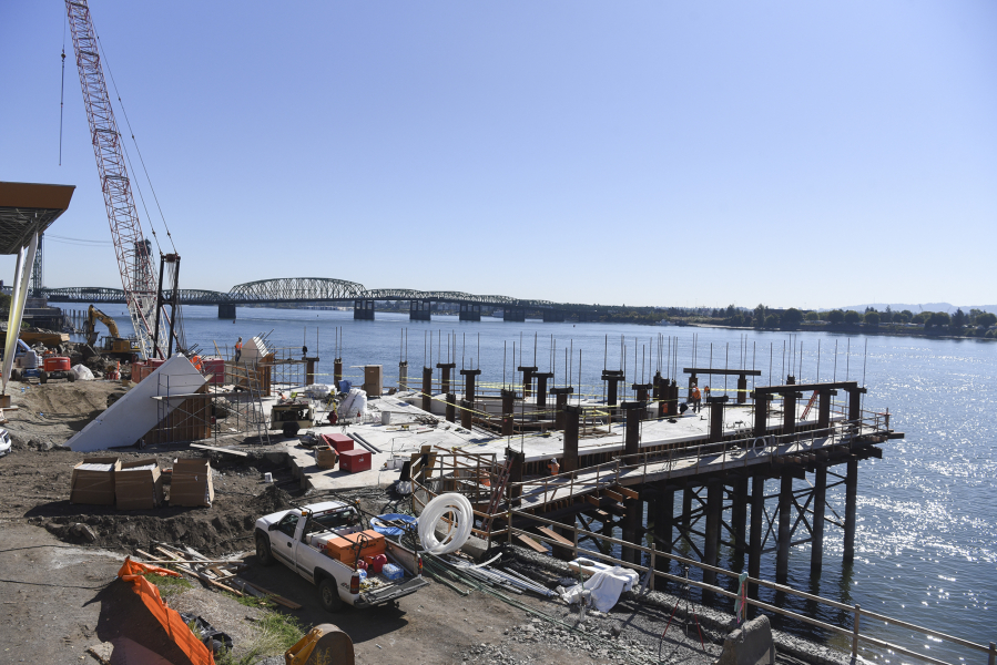 Construction on the Grant Street Pier at The Waterfront Vancouver continued Thursday. The pier could be completed by February, according to Gramor Development.