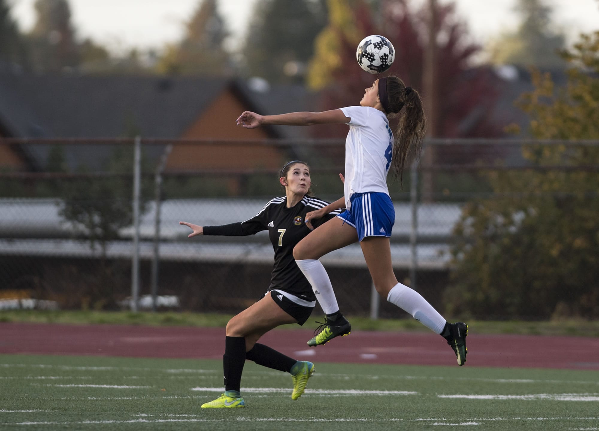 Mountain View's Olivia Fothergill (4) jumps for a header as Prairie's Madison Ellis (7) defends her during Wednesday night's game at Makenzie Stadium in Vancouver on Oct. 11, 2017. Mountain View defeated Prairie 3-0.