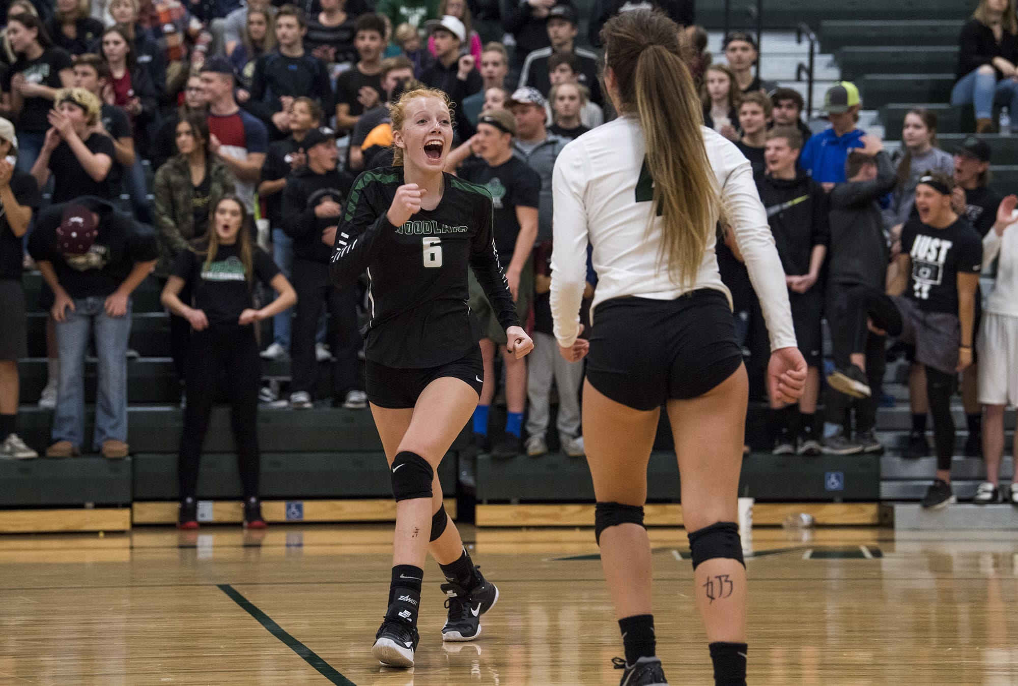 Woodland's Emma Swett (6) celebrates a point during the match at Woodland High School on Tuesday evening, Oct. 17, 2017. Woodland won the match 3-1.