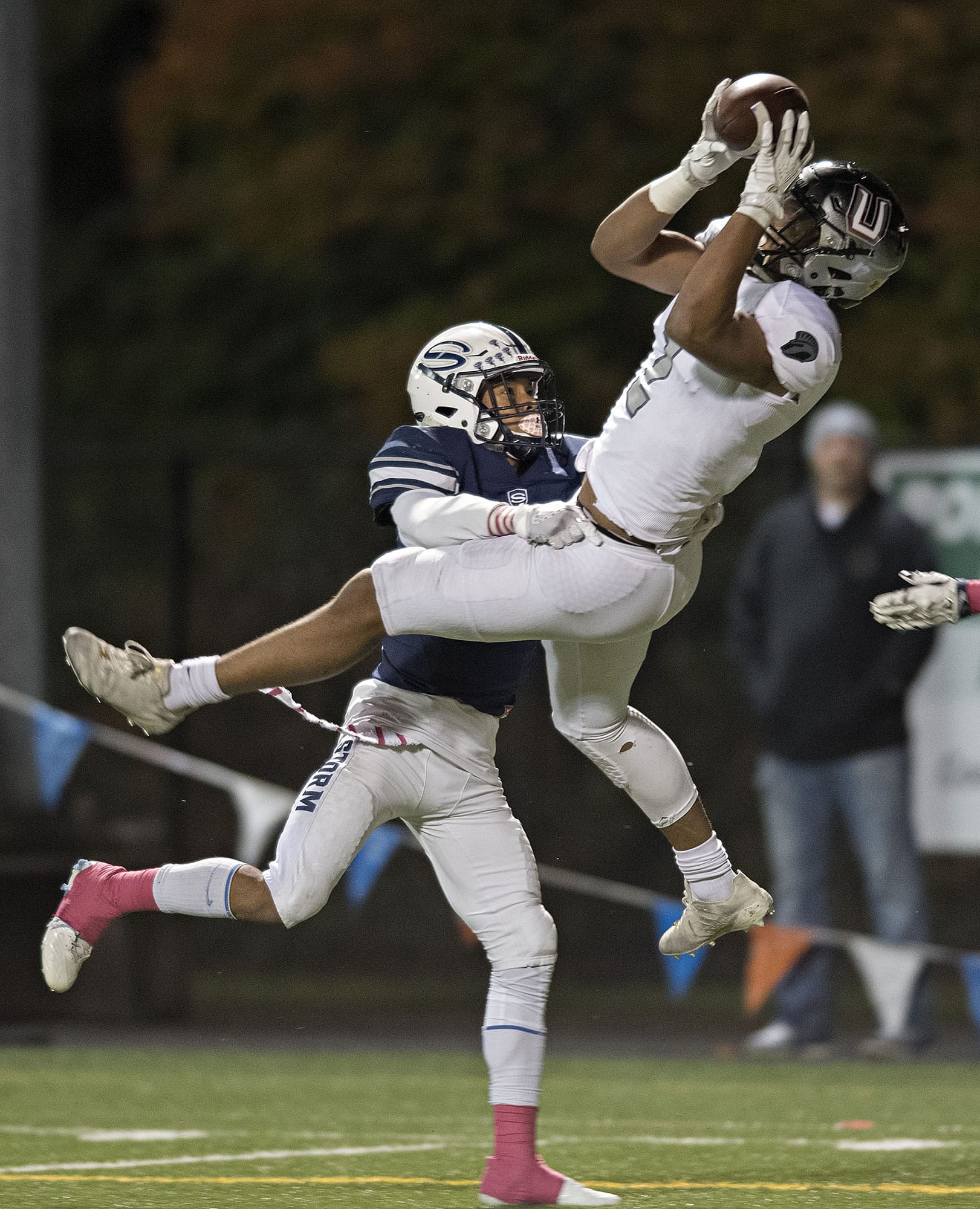 Union's Alishawuan Taylor (2) attempts to hang onto a pass while defended by Skyview's Tavis Pinkney (6) in the first quarter at Kiggins Bowl on Friday night, Oct. 20, 2017.
