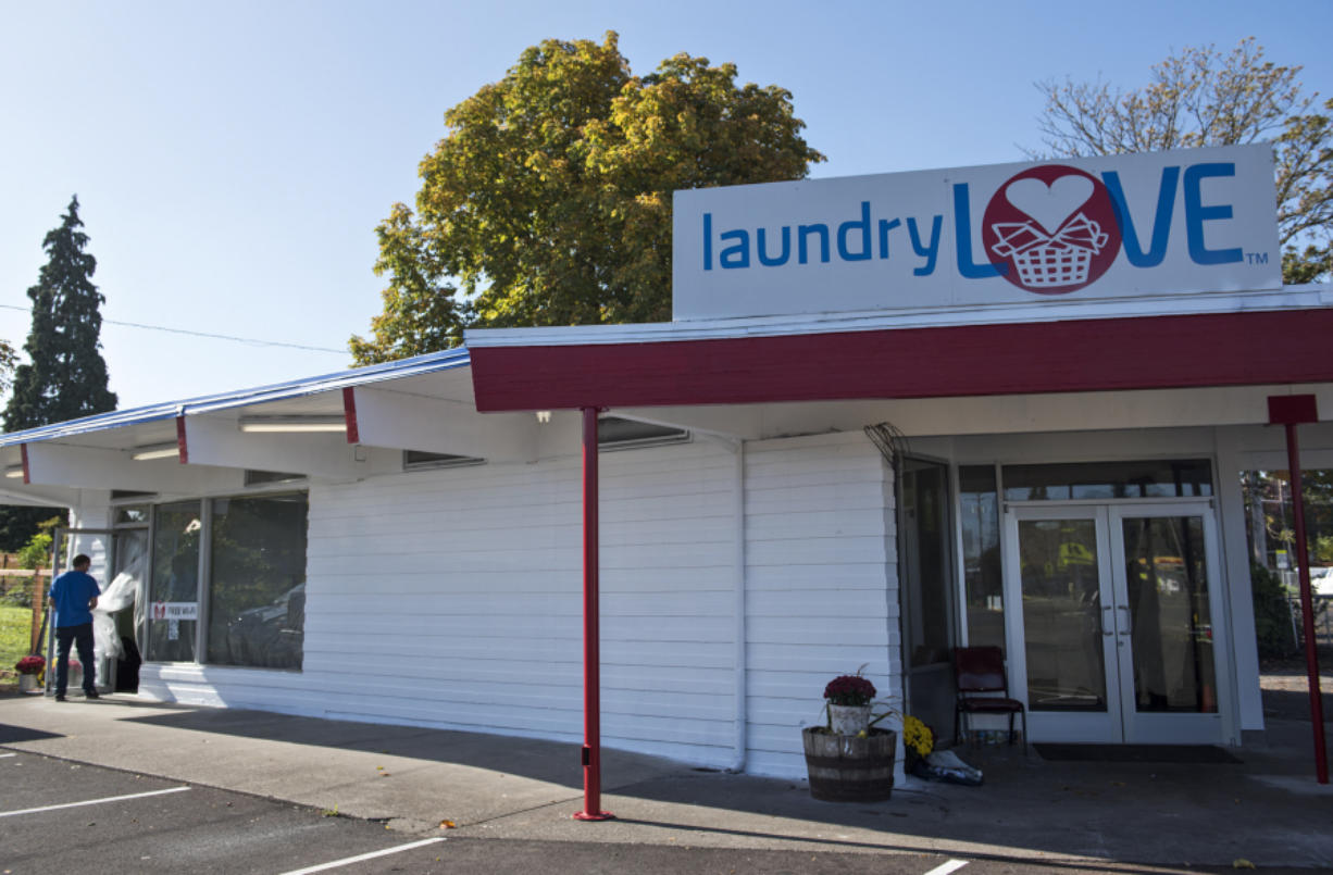 The front facade of Laundry Love, a coin-operated laundromat, was repaired and the cinder block exterior repainted after a Dodge Charger crashed into the building in May. The laundromat could open next month.