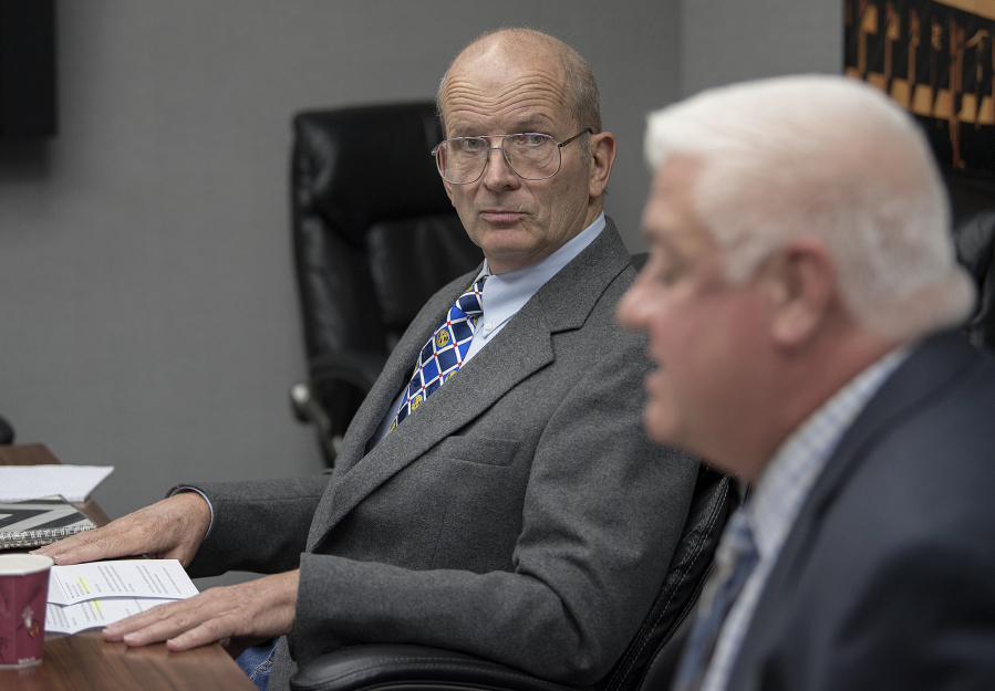 Don Orange, left, and Kris Greene, both candidates for Port of Vancouver commissioner, speak to members of the editorial board at The Columbian in September.