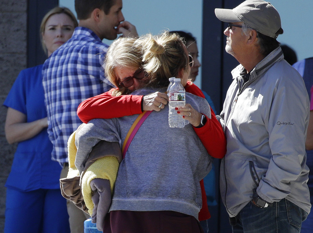 Two women embrace outside of a family assistance center Monday, Oct. 2, 2017, in Las Vegas. The makeshift center was set up to help families and others reconnect after the mass shooting on the Las Vegas Strip.