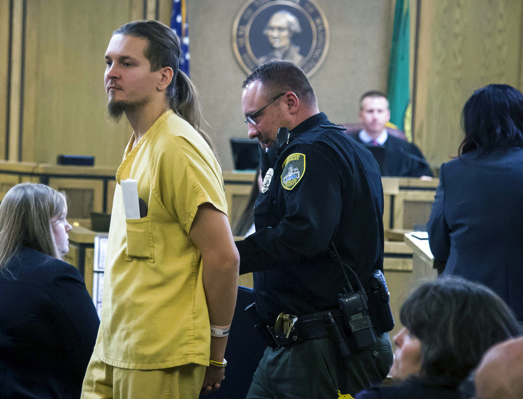 Hubert Wiecek, a member of the Polish metal band Decapitated, appears before Superior Court Judge John Cooney, Friday, Oct. 20, 2017, in Spokane, Wash. The final two members of the Polish metal band Decapitated had bail set at $100,000 each Friday on rape and kidnapping charges after they were arrested for the gang-rape of a woman on their tour bus following a show last summer.