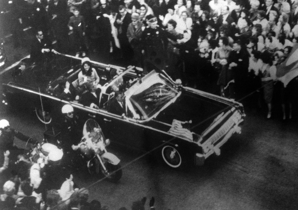 This image provided by the Warren Commission is  an overhead view of President John F. Kennedy's car in Dallas motorcade on Nov. 22, 1963, and was the commission's Exhibit No. 698. Special agent Clinton J. Hill is shown riding atop the rear of the limousine. President Donald Trump is caught in a push-pull on new details of Kennedy’s assassination, jammed between students of the killing who want every scrap of information and intelligence agencies that are said to be counseling restraint.  How that plays out should be known on Oct. 26, 2017, when long-secret files are expected to be released.