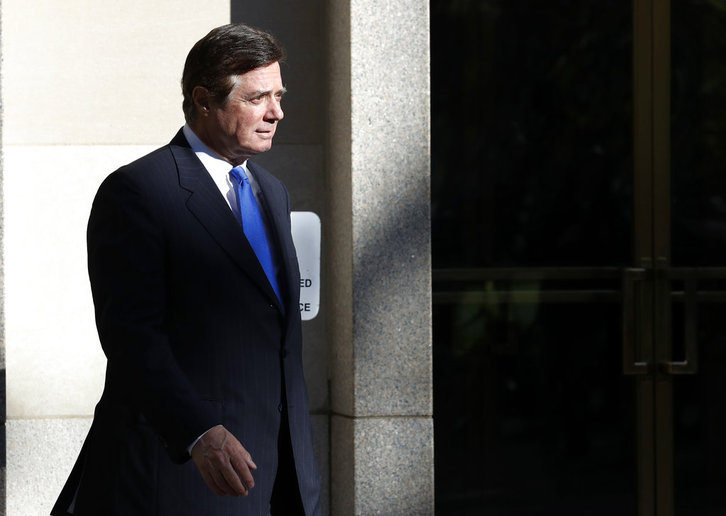 Paul Manafort walks from Federal District Court in Washington, Monday, Oct. 30, 2017. Manafort, President Donald Trump's former campaign chairman, and Manafort's business associate Rick Gates pleaded not guilty to felony charges of conspiracy against the United States and other counts.