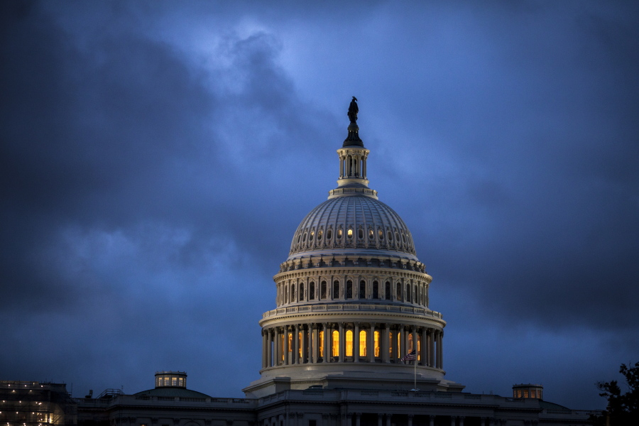 The Capitol is seen at dawn as overnight storm clouds pass Tuesday in Washington. J.