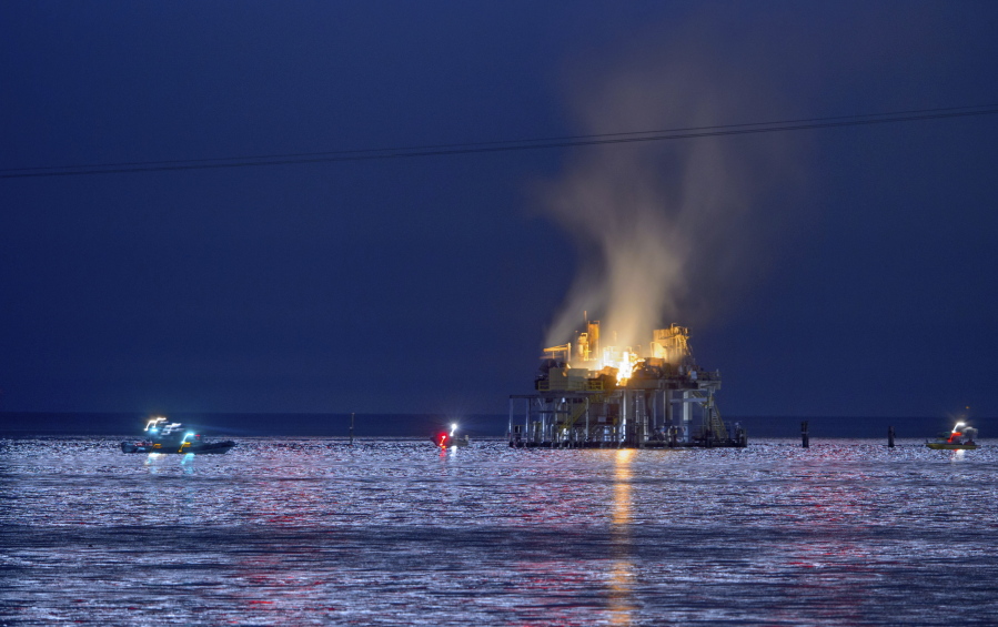 Jefferson Parish, La., authorities and others from other parishes respond to an oil rig explosion in Lake Pontchartrain off Kenner, La., on Sunday.