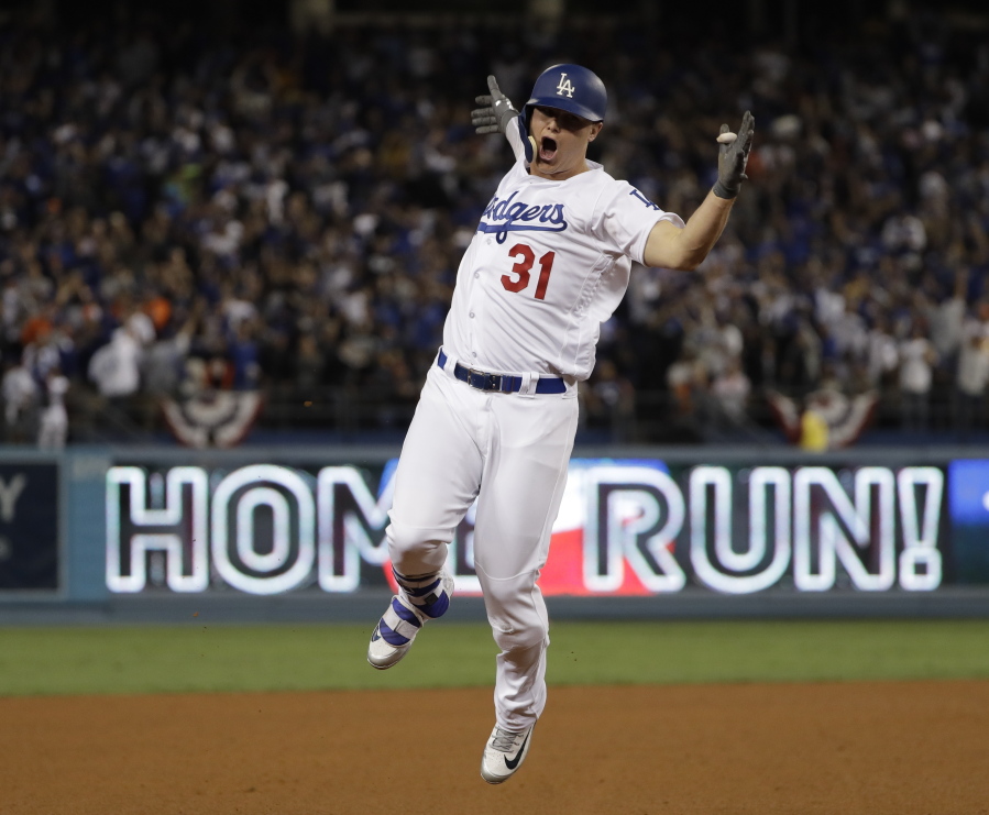 Los Angeles Dodgers’ Joc Pederson celebrates after hitting a home run during the seventh inning of Game 6 of baseball’s World Series against the Houston Astros Tuesday, Oct. 31, 2017, in Los Angeles.